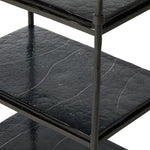 Elevate cocktail hour with an always-in-style rolling bar cart. Crafted from black hammered metal with three tiers of smoked cast glass, offering smooth surface space for storage and display Amethyst Home provides interior design, new home construction design consulting, vintage area rugs, and lighting in the Kansas City metro area.