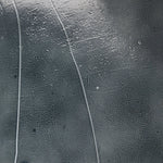 Elevate cocktail hour with an always-in-style rolling bar cart. Crafted from black hammered metal with three tiers of smoked cast glass, offering smooth surface space for storage and display Amethyst Home provides interior design, new home construction design consulting, vintage area rugs, and lighting in the Omaha metro area.