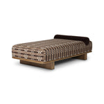 Taking inspiration from vintage Swedish textiles, this chaise serves double duty as an inviting seat and a one-of-a-kind conversation starter. It's a play of geometry and texture, from the sturdy wood frame and bold silhouette to the rich mix of upholstery and cut-in bolster cushion. Amethyst Home provides interior design, new home construction design consulting, vintage area rugs, and lighting in the Charlotte metro area.