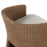 This outdoor dining chair takes on a curved silhouette, crafted from woven faux hyacinth and complemented by a heavily textured boucle cushion. Cover or store inside during inclement weather and when not in use.As lovers of natural materials at Amethyst, we love the designer inspired Thora Outdoor Dining Chair - Vada Cream. Amethyst Home provides interior design, new home construction design consulting, vintage area rugs, and lighting in the Park City metro area.