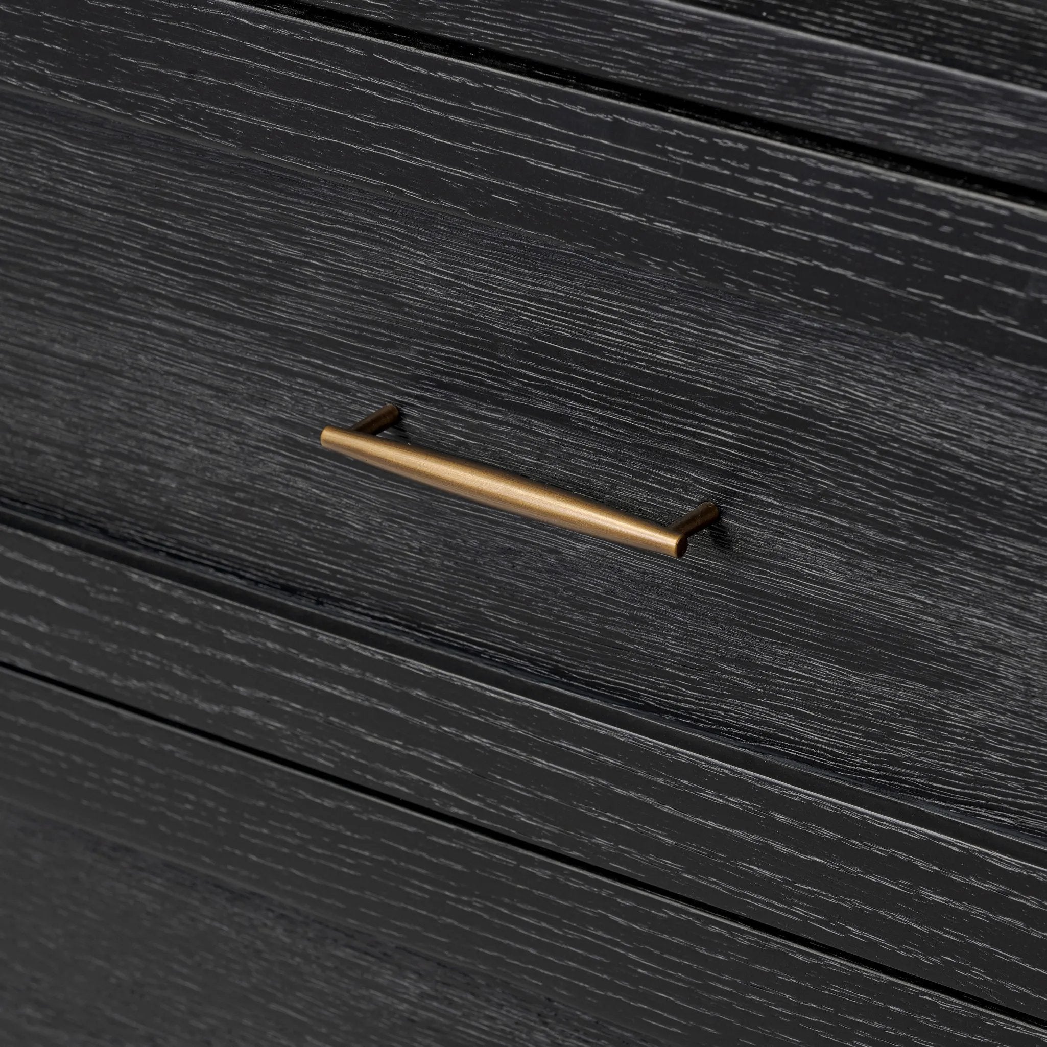 Infuse your collection with timeless midcentury design. Crafted from oak and parawood, a six-drawer dresser is finished in a matte black, with simple brass hardware Amethyst Home provides interior design, new home construction design consulting, vintage area rugs, and lighting in the Kansas City metro area.