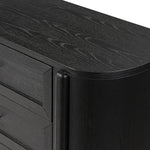 Infuse your collection with timeless midcentury design. Crafted from oak and parawood, a six-drawer dresser is finished in a matte black, with simple brass hardware Amethyst Home provides interior design, new home construction design consulting, vintage area rugs, and lighting in the Newport Beach metro area.