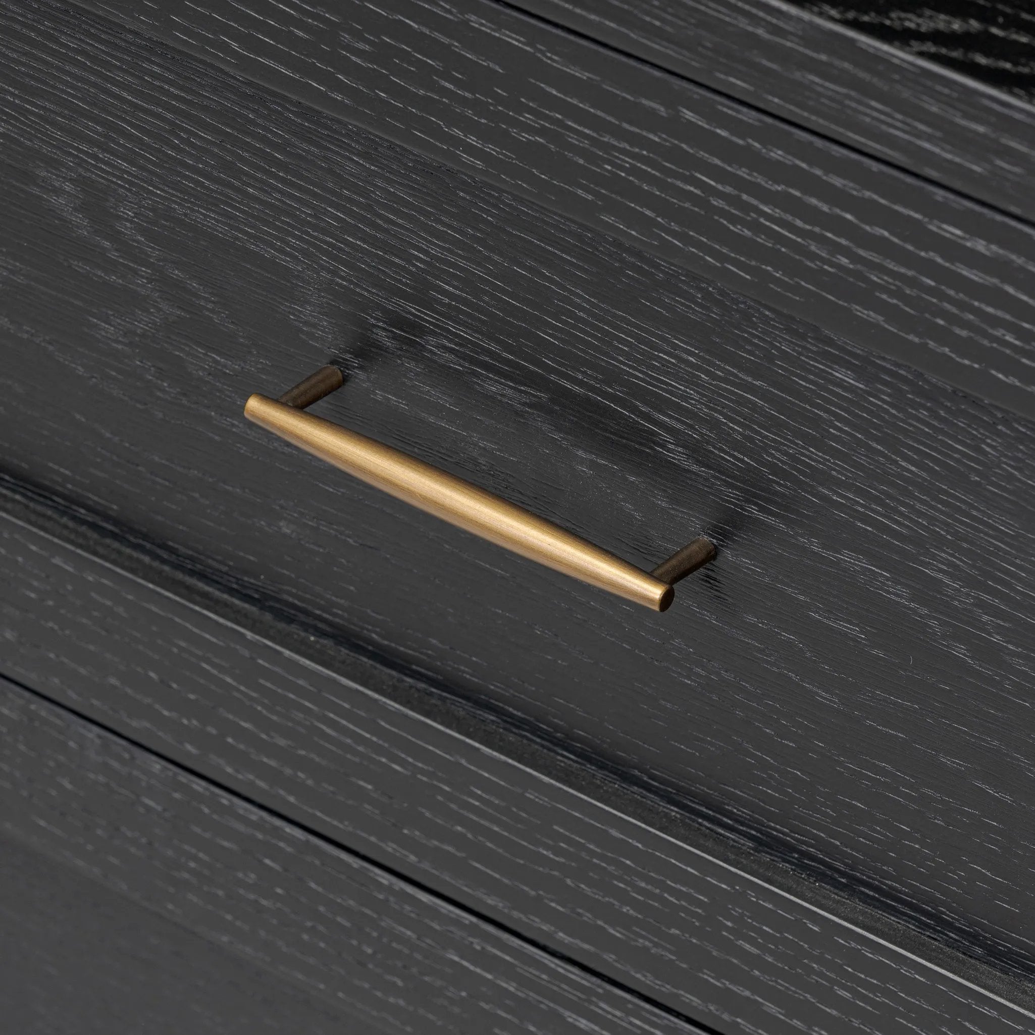 Infuse your collection with timeless midcentury design. Crafted from oak and parawood, a two-drawer nightstand is finished in a matte black, with simple brass hardware Amethyst Home provides interior design, new home construction design consulting, vintage area rugs, and lighting in the Des Moines metro area.