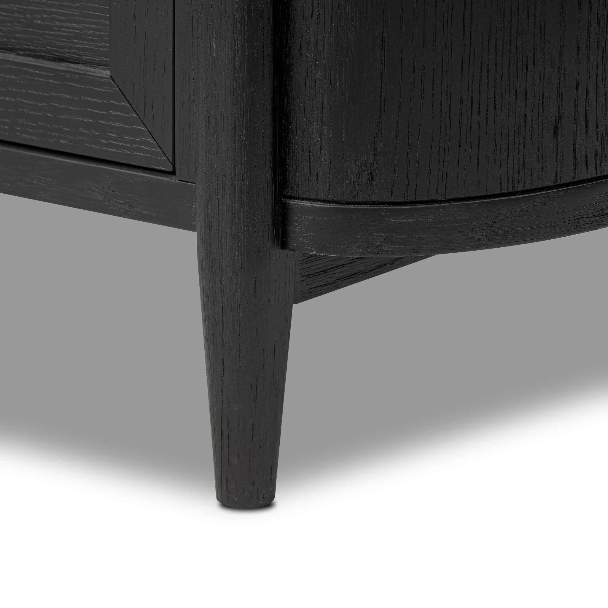 Infuse your collection with timeless midcentury design. Crafted from oak and parawood, a two-drawer nightstand is finished in a matte black, with simple brass hardware Amethyst Home provides interior design, new home construction design consulting, vintage area rugs, and lighting in the Kansas City metro area.