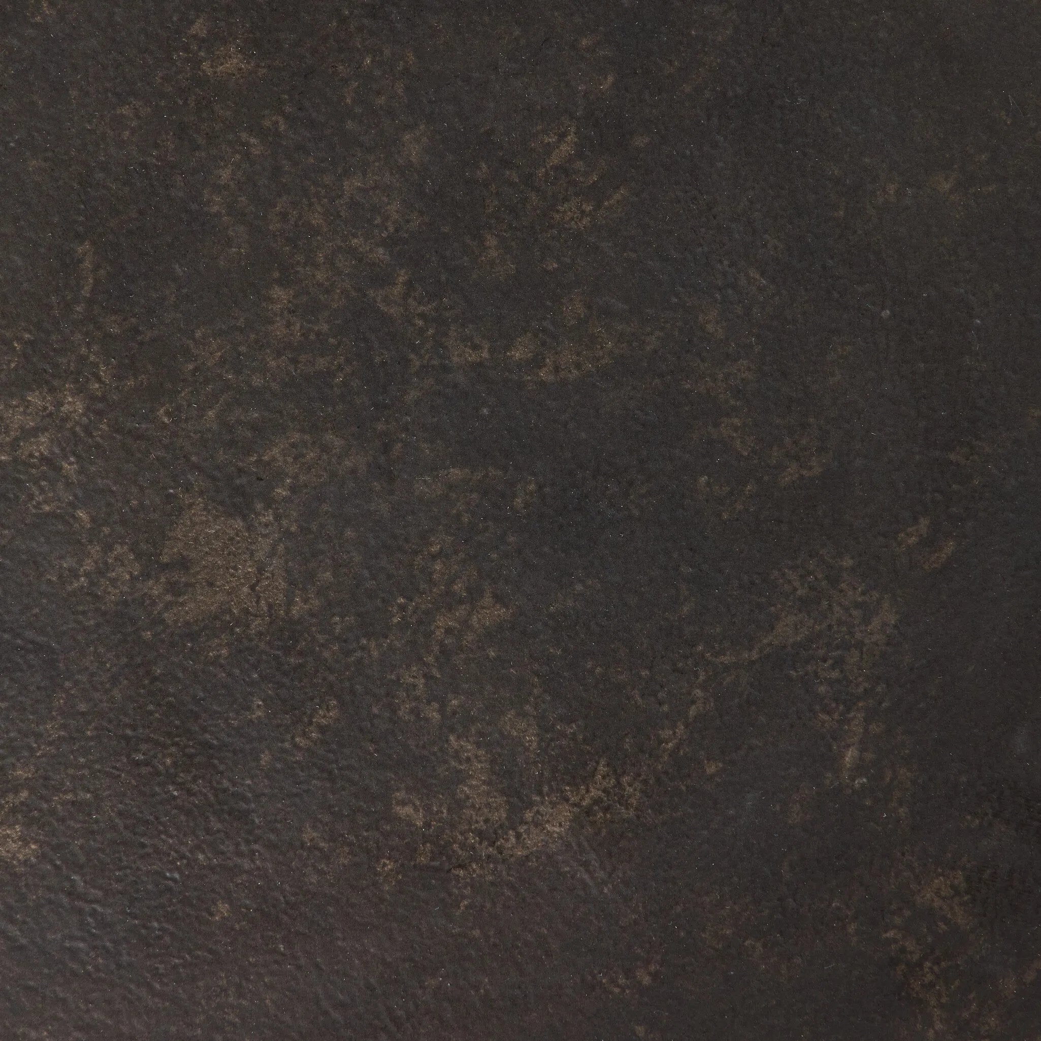 Made from distressed metal with a bronzed finish, an organically shaped end table features two tabletops, perfectly sized for your drink or favorite book Amethyst Home provides interior design, new home construction design consulting, vintage area rugs, and lighting in the Dallas metro area.