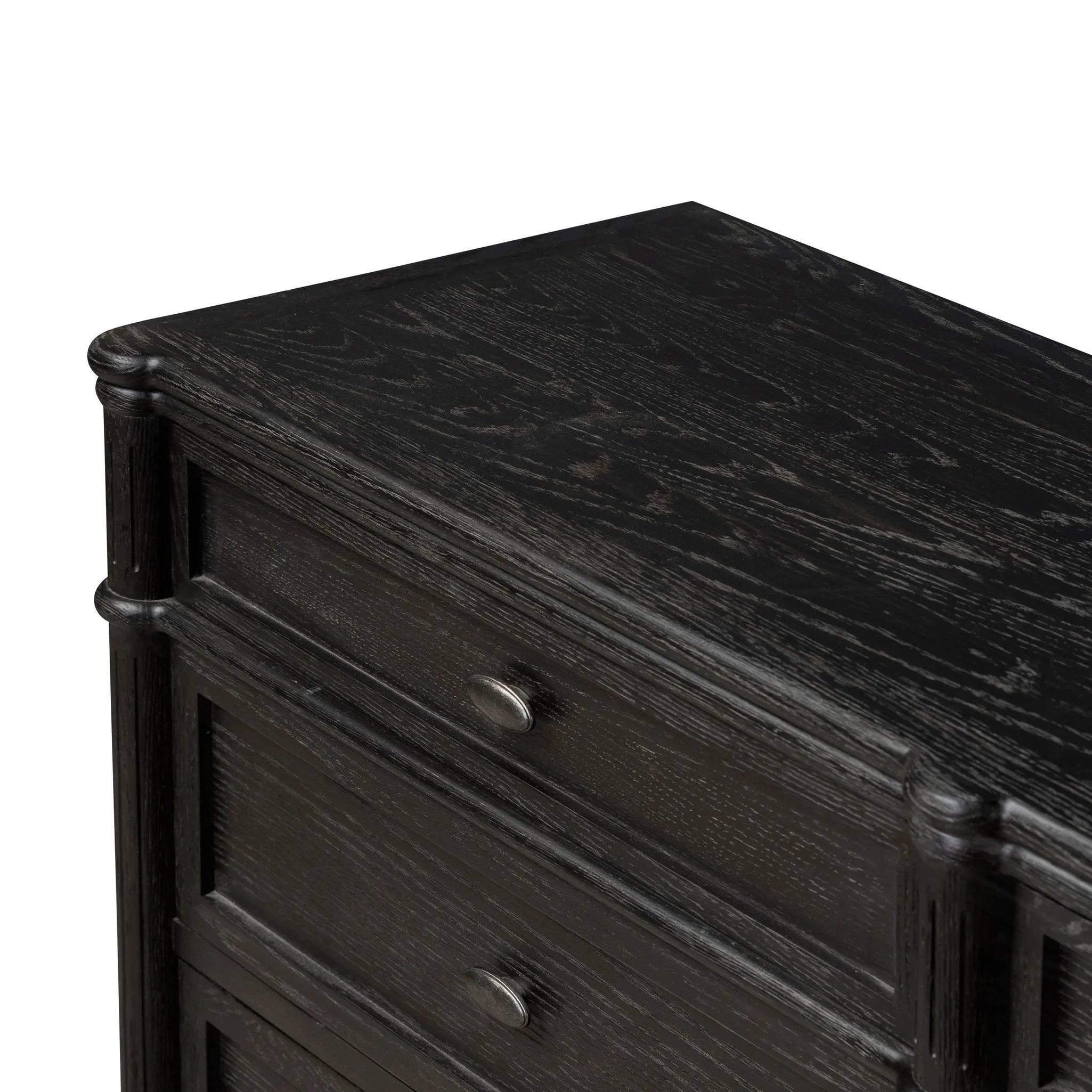 Made from distressed black-finished oak with slim legs, nine drawers bring antique European vibes to modern bedroom styling. This item has been modified to comply with the STURDY Act. See a full list of modified products and data changes in the “STURDY Act” file in the Downloads section below Amethyst Home provides interior design, new home construction design consulting, vintage area rugs, and lighting in the Austin metro area.