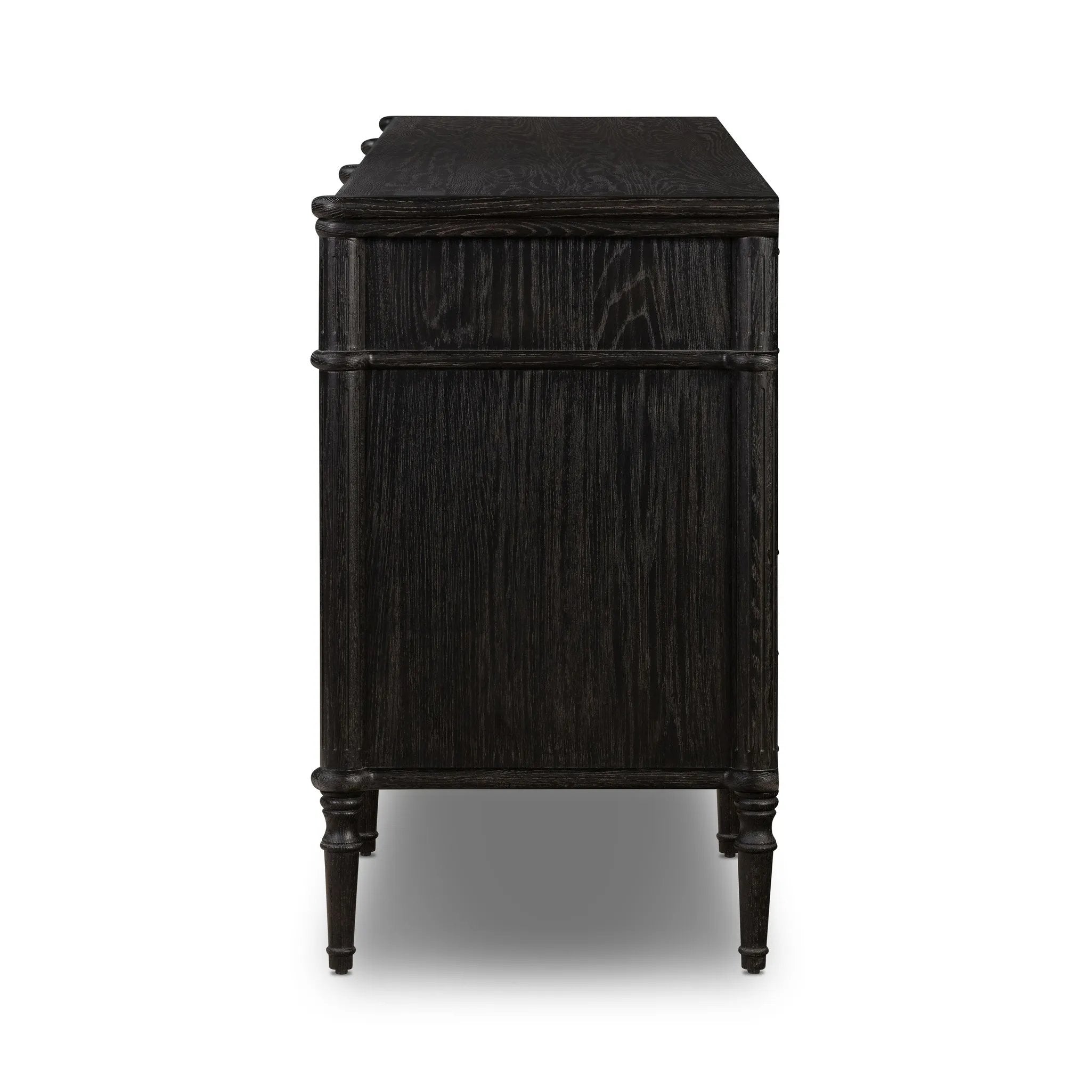 Made from distressed black-finished oak with slim legs, nine drawers bring antique European vibes to modern bedroom styling. This item has been modified to comply with the STURDY Act. See a full list of modified products and data changes in the “STURDY Act” file in the Downloads section below Amethyst Home provides interior design, new home construction design consulting, vintage area rugs, and lighting in the Charlotte metro area.