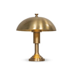 Inspired by 1920s banker lights, a brass-finished metal lamp brightens any workspace or tabletop with a warm glow. A stepped base and thick post add presence Amethyst Home provides interior design, new home construction design consulting, vintage area rugs, and lighting in the Laguna Beach metro area.