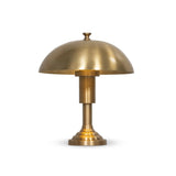 Inspired by 1920s banker lights, a brass-finished metal lamp brightens any workspace or tabletop with a warm glow. A stepped base and thick post add presence Amethyst Home provides interior design, new home construction design consulting, vintage area rugs, and lighting in the Laguna Beach metro area.