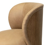 Great for smaller spaces or a reading nook, this petite slipper chair is wrapped in top-grain leather and backed with textured wood that folds into wings, cradling the head and shoulders for a little extra support. Features a 360-degree swivel base. Amethyst Home provides interior design, new home construction design consulting, vintage area rugs, and lighting in the Omaha metro area.