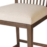 A low, linear counter stool inspired by Japanese tea houses, crafted from natural ash. Designed for comfort, a thick cushion seat is upholstered in a casual poly-linen blend Amethyst Home provides interior design, new home construction design consulting, vintage area rugs, and lighting in the Omaha metro area.