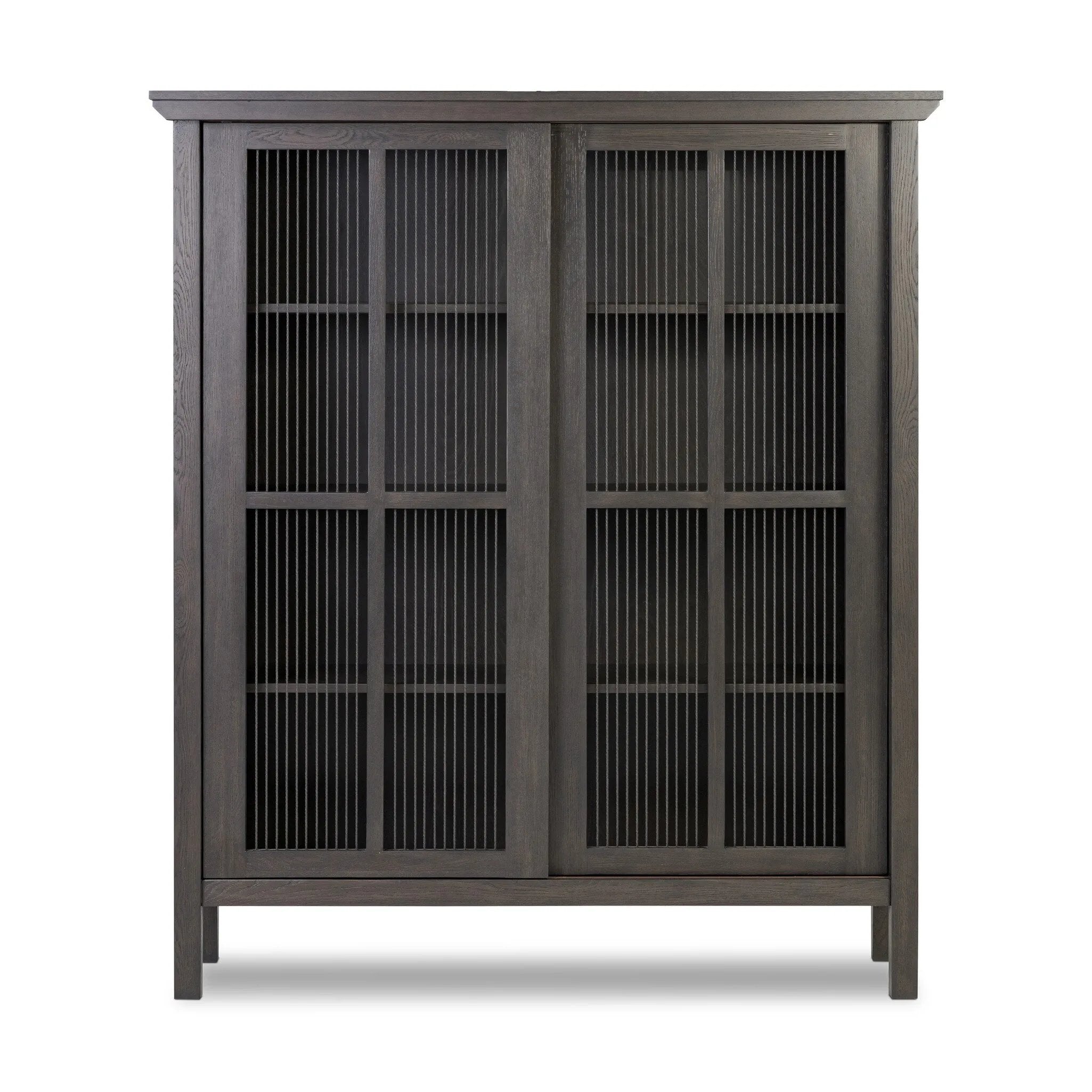 Long sliding doors with paper cord stripes inspired by Japanese teahouses bring a traditional look to this spacious cabinet. Made from oak in a smoked black finish, with a slightly oversized top.As lovers of luxe aesthetics at Amethyst, we love the optimistic inspired Tuscola Cabinet. Amethyst Home provides interior design, new home construction design consulting, vintage area rugs, and lighting in the Portland metro area.