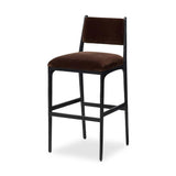 A metal frame with a tapered profile pairs with a velvety brown upholstered seat and back, striking balance in both scale in texture. Perfectly scaled for the counter.As lovers of wabi sabi design at Amethyst, we love the warm modern inspired Valeene Bar + Counter Stool. Amethyst Home provides interior design, new home construction design consulting, vintage area rugs, and lighting in the Tampa metro area.