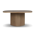 Center your dining space with a beautifully simple style inspired by soft Brutalism. Made from solid mindi with a light, sandy finish, this monolithic piece features a unique "squircle" tabletop, with flowing curves on its edges. A substantial plinth base is rotated to a 45-degree angle to highlight this piece's playful shaping Amethyst Home provides interior design, new home construction design consulting, vintage area rugs, and lighting in the Portland metro area.