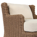 This outdoor chair's sculpted shape mimics classic wingback armchairs, with a double-twist woven material framing heavily textured boucle fabric for added visual weight. Cover or store inside during inclement weather or when not in use. Amethyst Home provides interior design, new home construction design consulting, vintage area rugs, and lighting in the Omaha metro area.