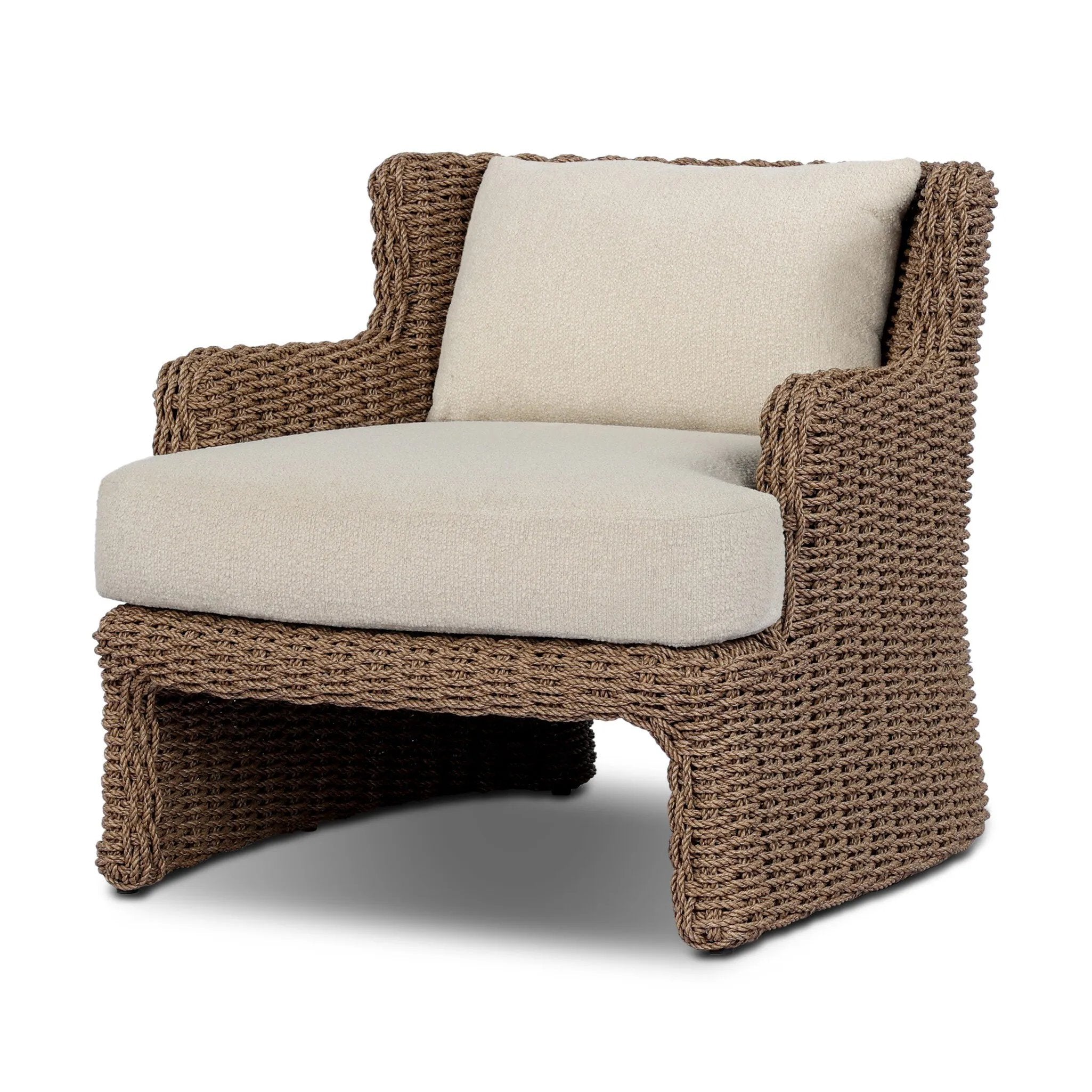 This outdoor chair's sculpted shape mimics classic wingback armchairs, with a double-twist woven material framing heavily textured boucle fabric for added visual weight. Cover or store inside during inclement weather or when not in use. Amethyst Home provides interior design, new home construction design consulting, vintage area rugs, and lighting in the Tampa metro area.