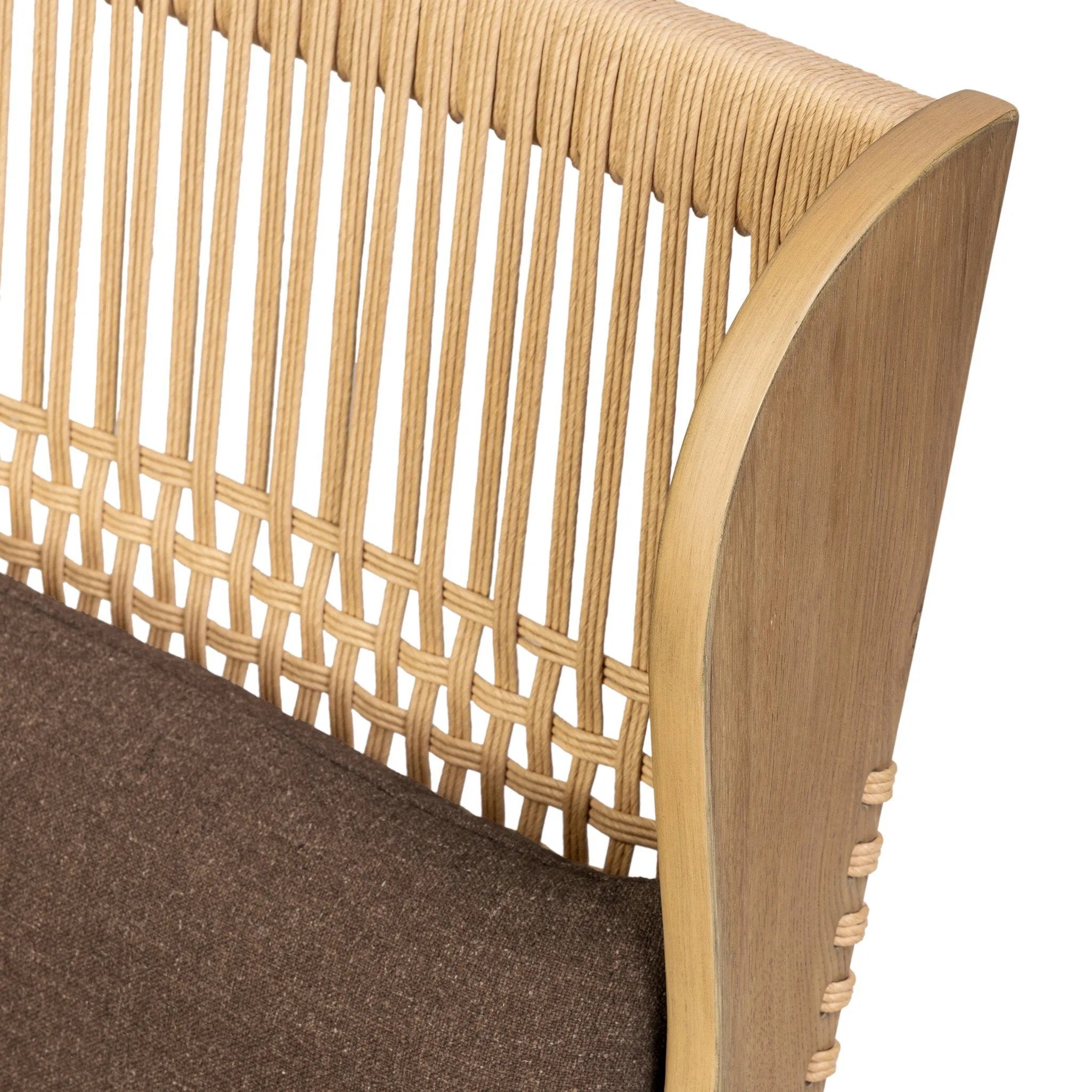 A timeless silhouette reimagined in a new way. Wrapped in high performance fabric, this wingback chair offers a rich, coffee-brown depth highlighted by delicate, linen flecks with natural highs and lows. Woven back and aged oak add beautiful character.As fans of organic modern design at Amethyst, we love the warm modern inspired Vestavia Chair. Amethyst Home provides interior design, new home construction design consulting, vintage area rugs, and lighting in the Dallas metro area.