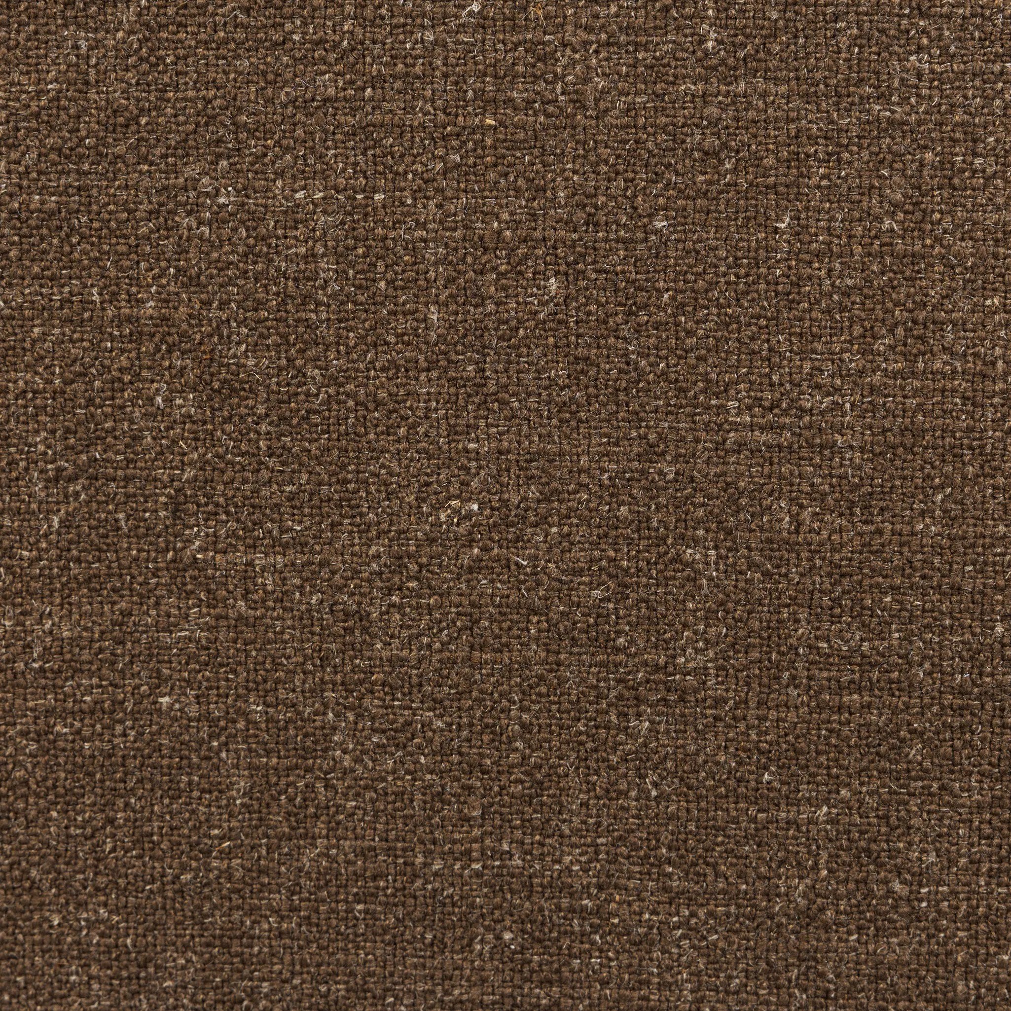 A timeless silhouette reimagined in a new way. Wrapped in high performance fabric, this wingback chair offers a rich, coffee-brown depth highlighted by delicate, linen flecks with natural highs and lows. Woven back and aged oak add beautiful character.As fans of organic modern design at Amethyst, we love the warm modern inspired Vestavia Chair. Amethyst Home provides interior design, new home construction design consulting, vintage area rugs, and lighting in the Los Angeles metro area.