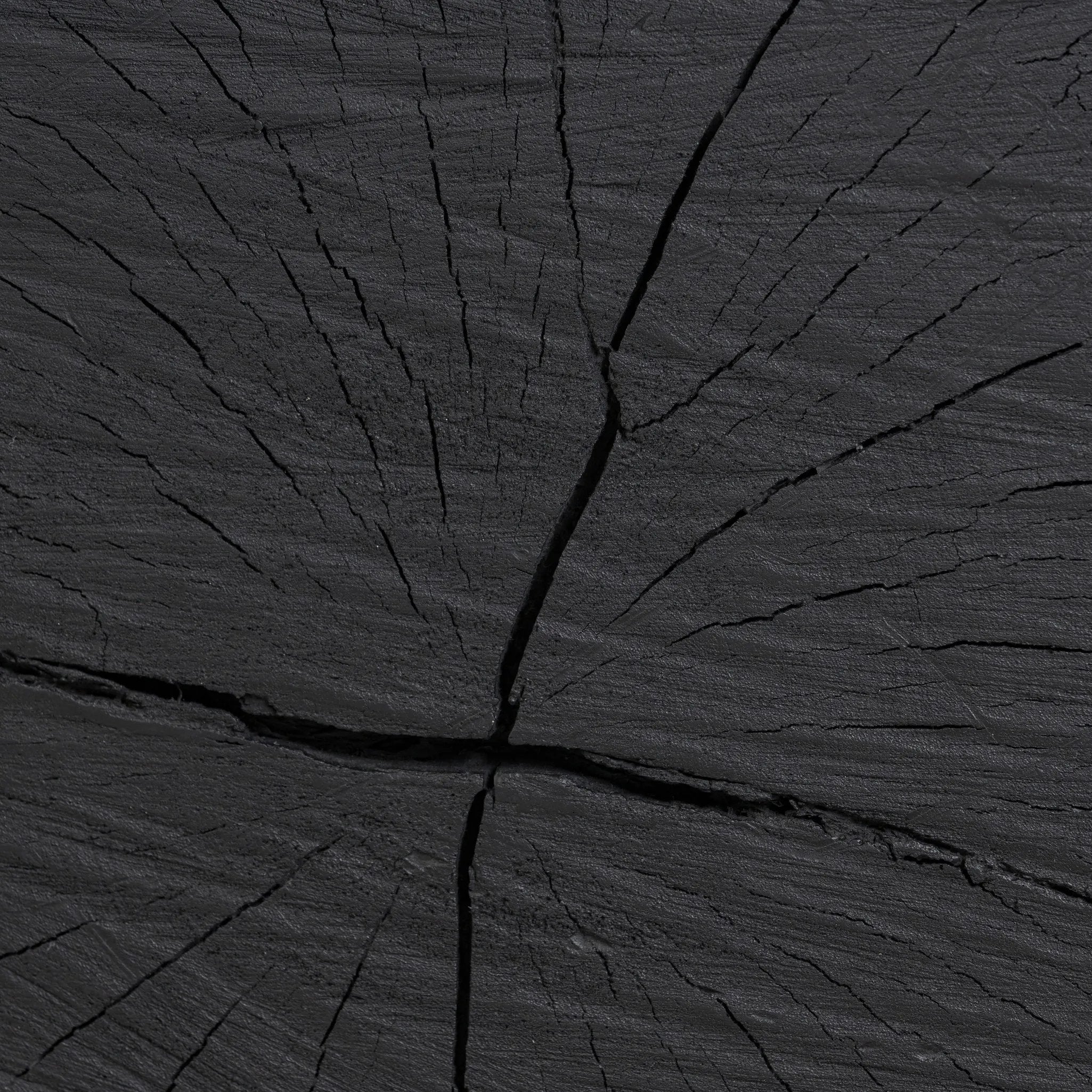 Ground any room with a style inspired by the beautiful simplicity of nature. Made of black-finished resin, the form for this special piece is molded from a tree trunk that's been cut into a square, then cast in resin to recreate the same  texture of the trunk, even the saw marks where it was cut — talk about a true statement piece Amethyst Home provides interior design, new home construction design consulting, vintage area rugs, and lighting in the Charlotte metro area.