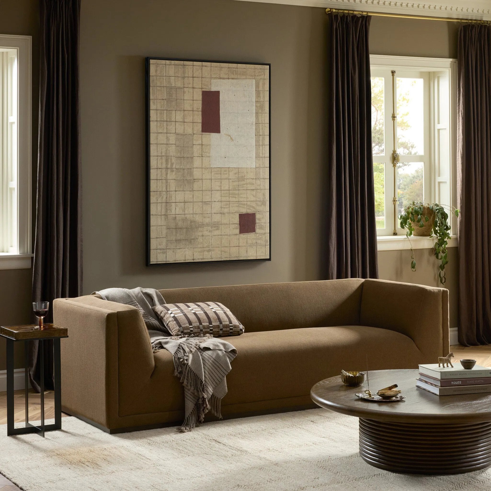 An inviting take on the classic tuxedo sofa, made for modern living. Celebrating mitered corners, for precision at every angle, and a layered, upholstered frame for a sharp, architectural look, the sofa rests on a wood plinth base. Tailored in the United States with thick pocket-seam cushions for unexpected comfort. Amethyst Home provides interior design, new home construction design consulting, vintage area rugs, and lighting in the Kansas City metro area.