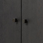 Lacquered cabinets make for evocative storage with their everlasting glossy finish. Great for small spaces, this sideboard with interior shelves features worn black oak doors for balance and contrast Amethyst Home provides interior design, new home construction design consulting, vintage area rugs, and lighting in the Miami metro area.