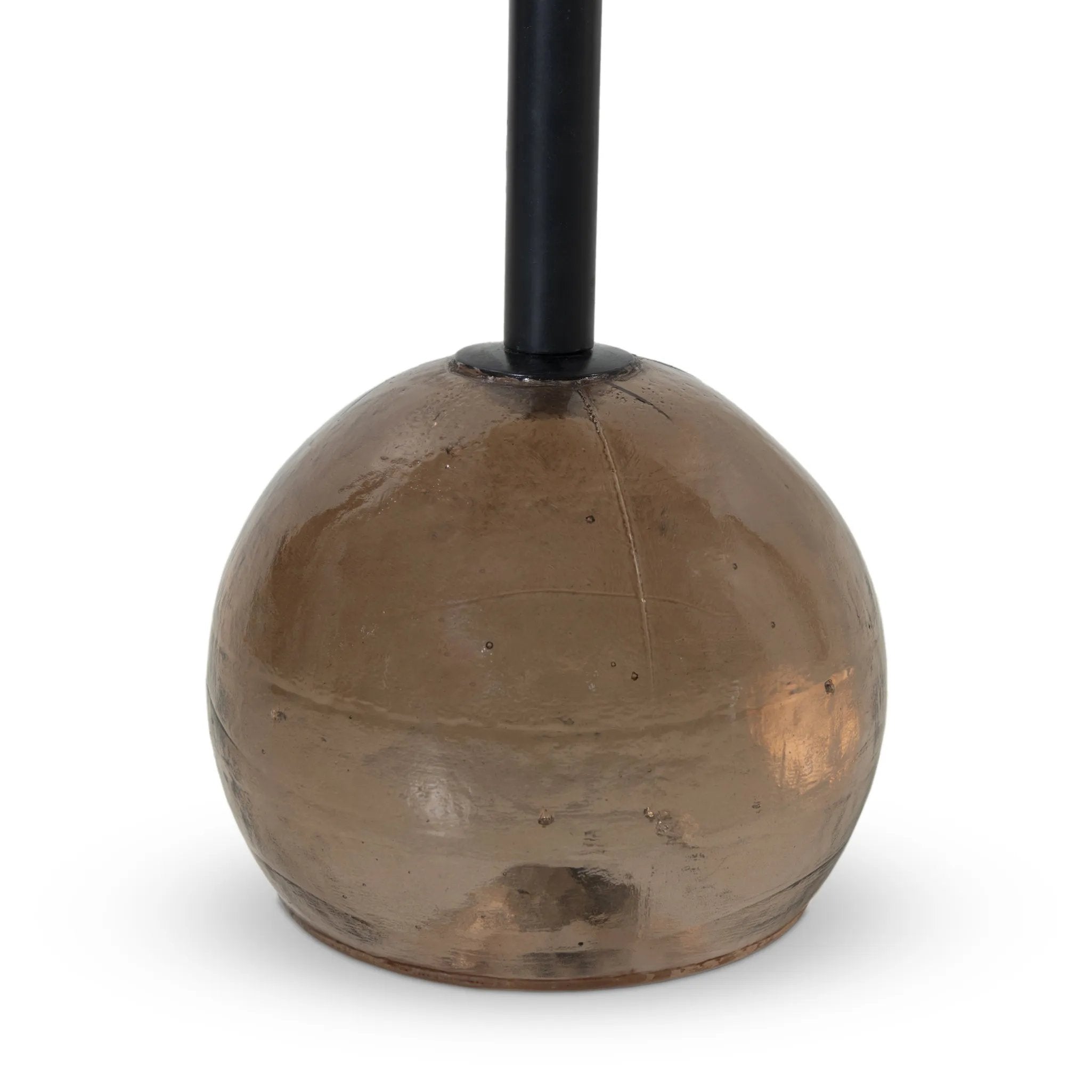 A sphere-shaped base of amber cast glass supports slim, black-finished iron piping and a tray-style tabletop that's perfectly sized to keep your favorite book or nightcap within reach Amethyst Home provides interior design, new home construction design consulting, vintage area rugs, and lighting in the Kansas City metro area.