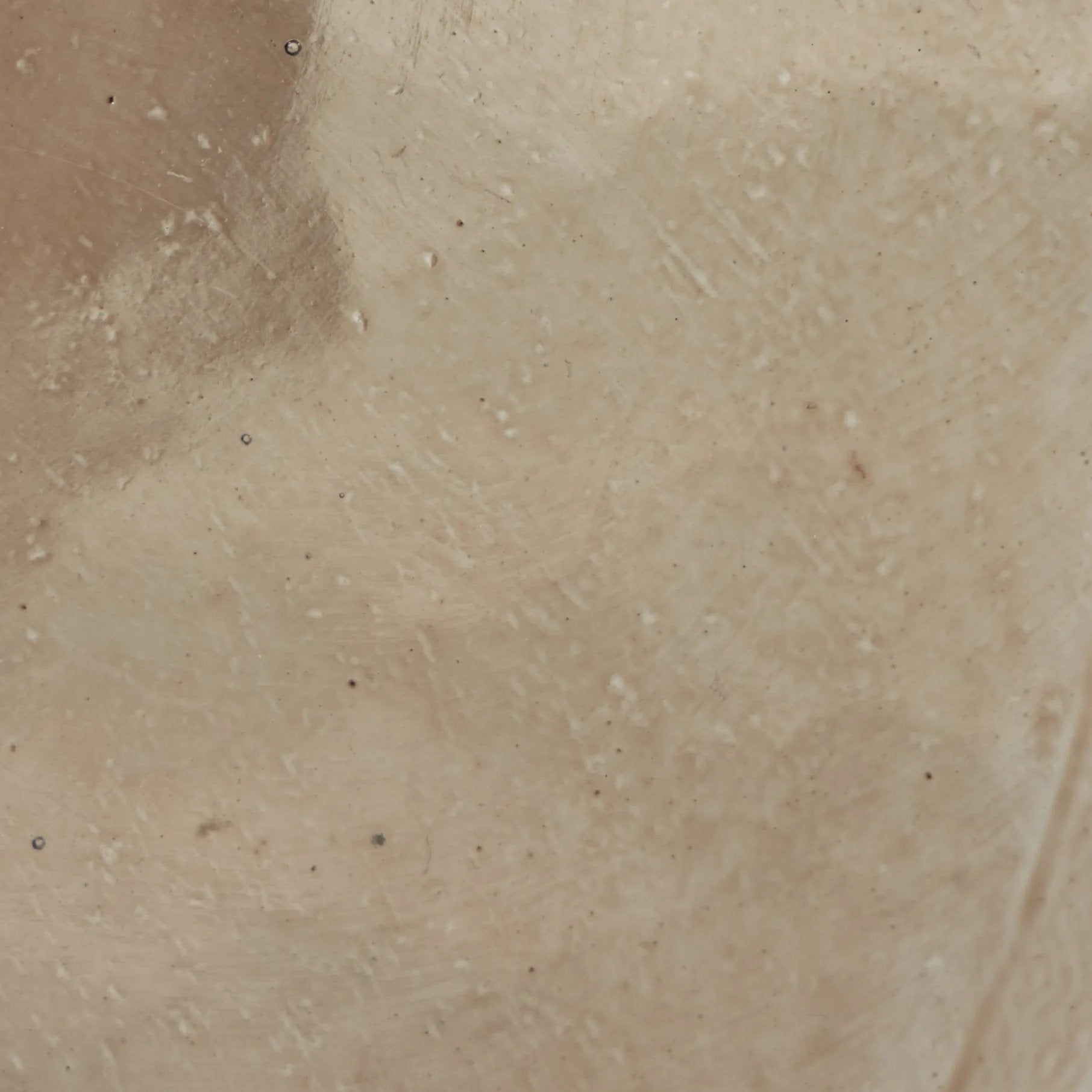 A sphere-shaped base of amber cast glass supports slim, black-finished iron piping and a tray-style tabletop that's perfectly sized to keep your favorite book or nightcap within reach Amethyst Home provides interior design, new home construction design consulting, vintage area rugs, and lighting in the Seattle metro area.