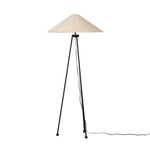 An exaggeratedly slim, airy tripod base of black-finished iron supports a light beige shade of 100% cotton, for a classic look with contrast Amethyst Home provides interior design, new home construction design consulting, vintage area rugs, and lighting in the Boston metro area.