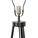 An exaggeratedly slim, airy tripod base of black-finished iron supports a light beige shade of 100% cotton, for a classic look with contrast Amethyst Home provides interior design, new home construction design consulting, vintage area rugs, and lighting in the Charlotte metro area.