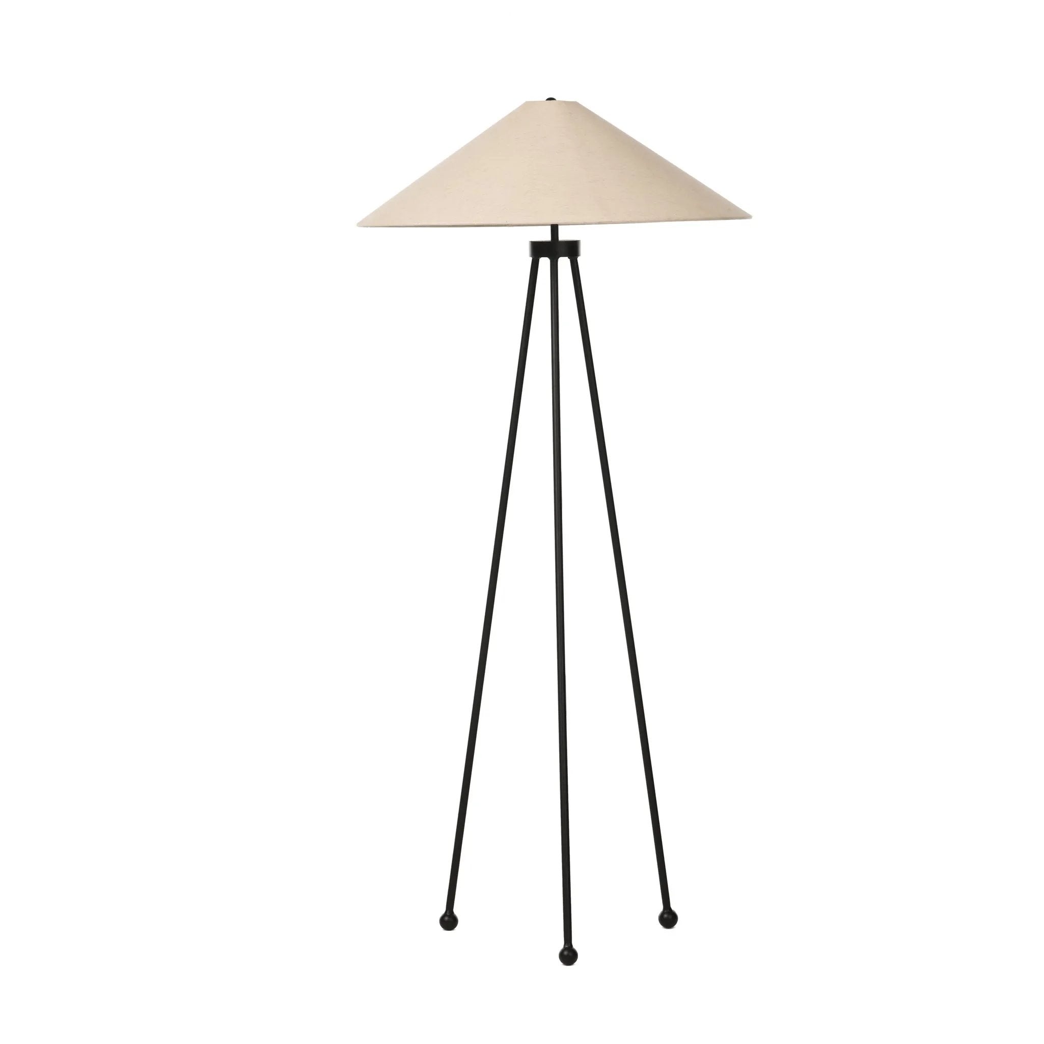 An exaggeratedly slim, airy tripod base of black-finished iron supports a light beige shade of 100% cotton, for a classic look with contrast Amethyst Home provides interior design, new home construction design consulting, vintage area rugs, and lighting in the Kansas City metro area.