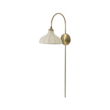 Slim and curved, a swan-neck arm supports a bell-shaped linen shade with brass boning, updating a traditional lighting look. This plug-in sconce design brings warm illumination to any space while discreet cord management keeps the look polished. Ideal for crafting warm, inviting reading corners or bedside ambiance Amethyst Home provides interior design, new home construction design consulting, vintage area rugs, and lighting in the Washington metro area.