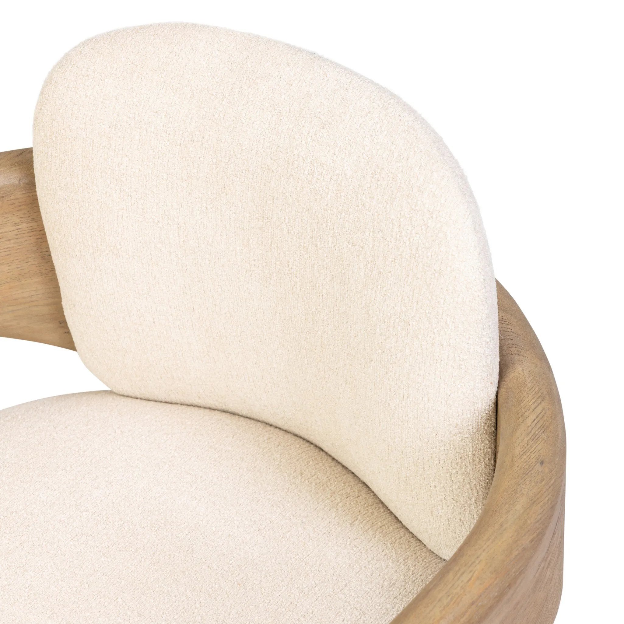 Striking from every view. This statement-making chair combines beautiful natural oak in tripod form with high-performance fabric. The cantilever design, with a wide plank back and sloping arms, form an eye-catching silhouette for the floating seat and overflowing back cushion. Amethyst Home provides interior design, new home construction design consulting, vintage area rugs, and lighting in the Scottsdale metro area.