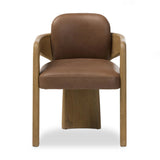 Striking from every view. This statement-making dining chair combines solid oak in tripod form with top-grain leather. The cantilever design, with a wide plank back and sloping arms, form an eye-catching silhouette for the floating seat and overflowing back cushion. Amethyst Home provides interior design, new home construction design consulting, vintage area rugs, and lighting in the Alpharetta metro area.