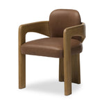 Striking from every view. This statement-making dining chair combines solid oak in tripod form with top-grain leather. The cantilever design, with a wide plank back and sloping arms, form an eye-catching silhouette for the floating seat and overflowing back cushion. Amethyst Home provides interior design, new home construction design consulting, vintage area rugs, and lighting in the Laguna Beach metro area.