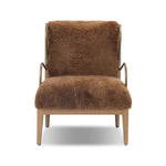 Bring the soul of a vintage find to your living room with this artfully updated accent chair. Solid ash legs and swooping iron arms give it a curated look, while a plush seat ensure comfort. Wrapped in cozy shearling to make any room feel instantly inviting. Amethyst Home provides interior design, new home construction design consulting, vintage area rugs, and lighting in the Houston metro area.