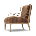 Bring the soul of a vintage find to your living room with this artfully updated accent chair. Solid ash legs and swooping iron arms give it a curated look, while a plush seat ensure comfort. Wrapped in cozy shearling to make any room feel instantly inviting. Amethyst Home provides interior design, new home construction design consulting, vintage area rugs, and lighting in the Seattle metro area.
