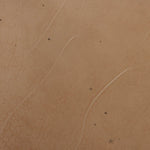 Smoky brown glass-topped table with slim, tapered matte black metal frames for a sleek, modern look. Part of a nesting set, c