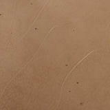 Smoky brown glass-topped table with slim, tapered matte black metal frames for a sleek, modern look. Part of a nesting set, c