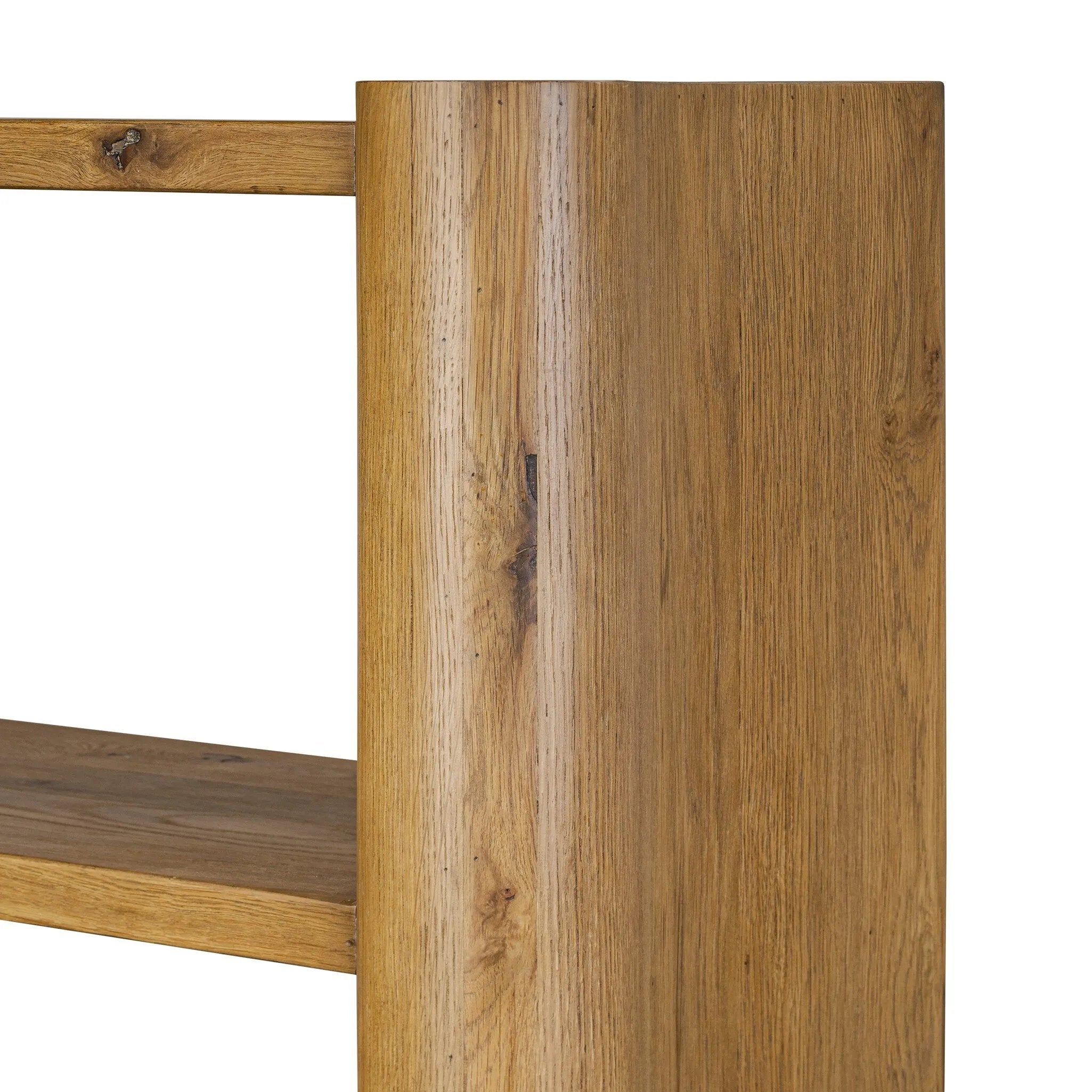 Thick, curvy and rounded sides give this bookcase its playful character inspired by soft Brutalism. Made from light, solid oak, substantial shelving provides generous space for books, photos and keepsakes Amethyst Home provides interior design, new home construction design consulting, vintage area rugs, and lighting in the Boston metro area.