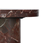 Shape and material share the spotlight in this pedestal-style end table of solid marble finished in a rich merlot with natural veining Amethyst Home provides interior design, new home construction design consulting, vintage area rugs, and lighting in the Charlotte metro area.