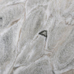 Shape and material share the spotlight in this large, tripod-style onyx coffee table. Turned, pillar legs and dramatic natural veining offer a look of movement. Option to pair with smaller matching table for a nested look Amethyst Home provides interior design, new home construction design consulting, vintage area rugs, and lighting in the Charlotte metro area.