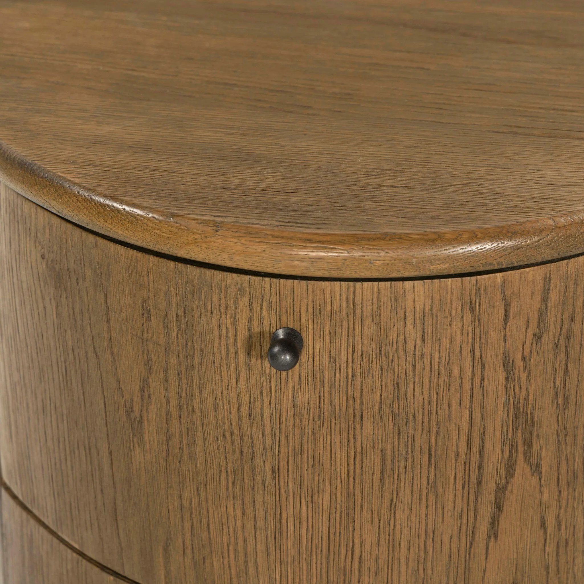 Modern with hints of heritage and Art Deco, crafted of warm, spiced oak. A flexible layering piece that can be styled just about anywhere — as a nightstand or in the entryway or hallway, its slight scale and demilune shape are great for smaller spaces, as its flat back can be styled right up against the wall. Amethyst Home provides interior design, new home construction design consulting, vintage area rugs, and lighting in the Laguna Beach metro area.
