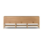 Simple yet refined, a Danish design-influenced sideboard is made from light-finished ash, with iron hardware finished in a sleek gunmetal. Perfect for larger spaces, with six doors and generous interior storage. Stretcher-style shelving made from woven paper cord serves up a textural finishing touch. Amethyst Home provides interior design, new home construction design consulting, vintage area rugs, and lighting in the Dallas metro area.