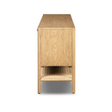 Simple yet refined, a Danish design-influenced sideboard is made from light-finished ash, with iron hardware finished in a sleek gunmetal. Perfect for larger spaces, with six doors and generous interior storage. Stretcher-style shelving made from woven paper cord serves up a textural finishing touch. Amethyst Home provides interior design, new home construction design consulting, vintage area rugs, and lighting in the Seattle metro area.