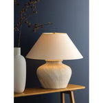 The Allards table lamp draws inspiration from traditional pottery and the beauty of artisan glazing. Its ceramic, urn-like silhouette is finished in Watercolor Sand with a painterly application that lends movement to the surface. Amethyst Home provides interior design, new home construction design consulting, vintage area rugs, and lighting in the Miami metro area.