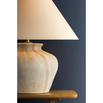 The Allards table lamp draws inspiration from traditional pottery and the beauty of artisan glazing. Its ceramic, urn-like silhouette is finished in Watercolor Sand with a painterly application that lends movement to the surface. Amethyst Home provides interior design, new home construction design consulting, vintage area rugs, and lighting in the Tampa metro area.