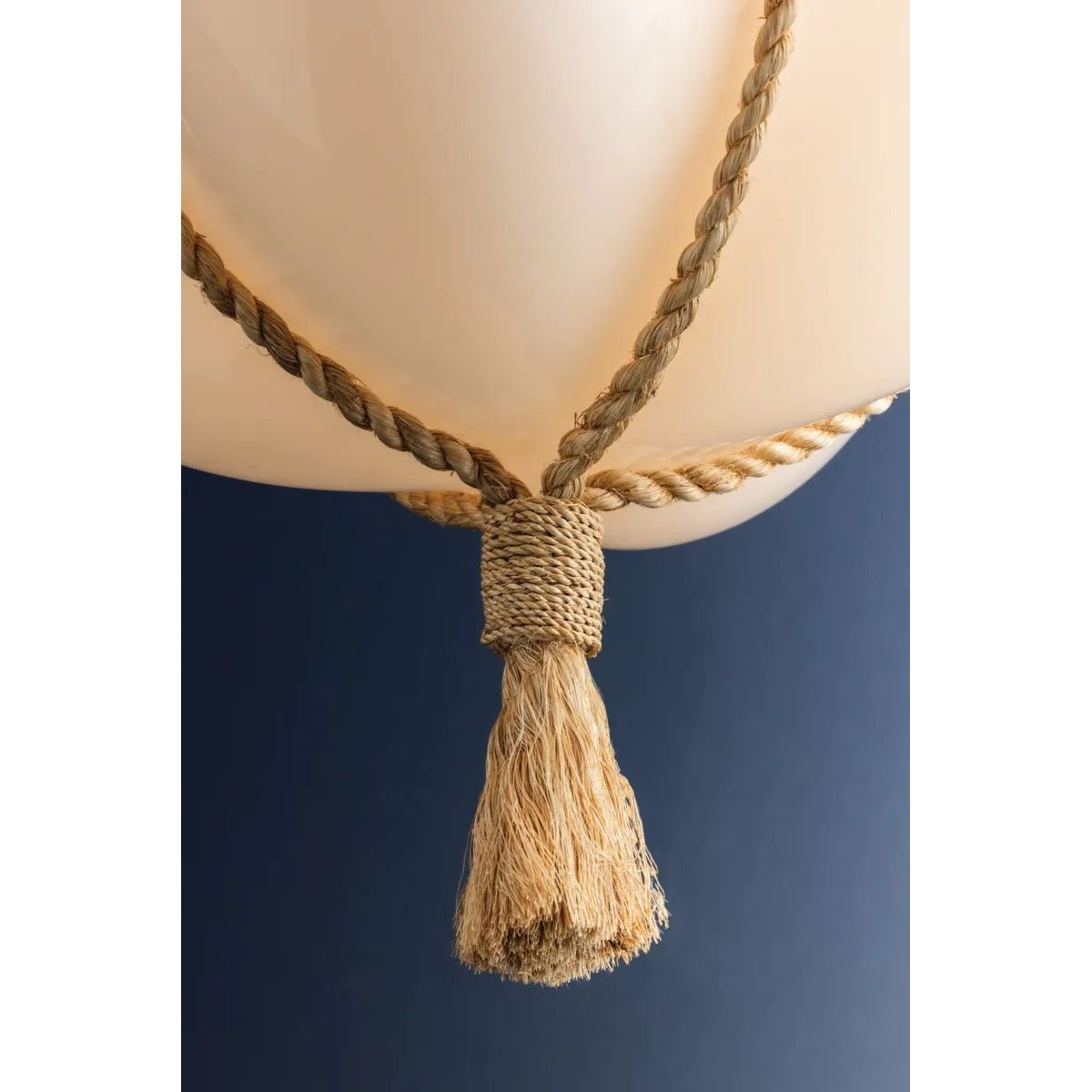 Celebrating the beauty of natural materials, the sophisticated Amberley pendant features a unique natural rope suspension and ethereal opal matte glass shade. Resembling a quatrefoil shape from above, the shade has four scalloped edges that nod to its botanical underpinnings. Amethyst Home provides interior design, new home construction design consulting, vintage area rugs, and lighting in the Nashville metro area.