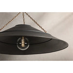 With its exposed metalwork, chain detailing, and unique finish combination, Arcane has an elevated, industrial vibe. The graphite shade feels chic and gives off a warm glow. The Patina Brass hardware, chain, and canopy add a hint of shine that plays wonderfully off the graphite. Amethyst Home provides interior design, new home construction design consulting, vintage area rugs, and lighting in the Los Angeles metro area.