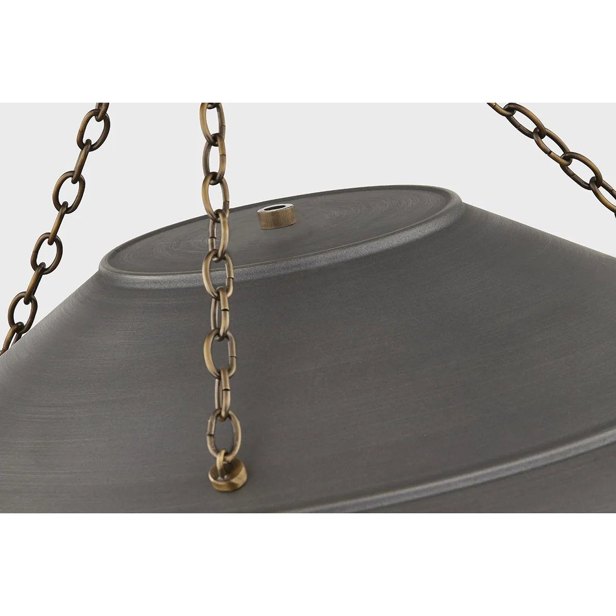 With its exposed metalwork, chain detailing, and unique finish combination, Arcane has an elevated, industrial vibe. The graphite shade feels chic and gives off a warm glow. The Patina Brass hardware, chain, and canopy add a hint of shine that plays wonderfully off the graphite. Amethyst Home provides interior design, new home construction design consulting, vintage area rugs, and lighting in the Newport Beach metro area.