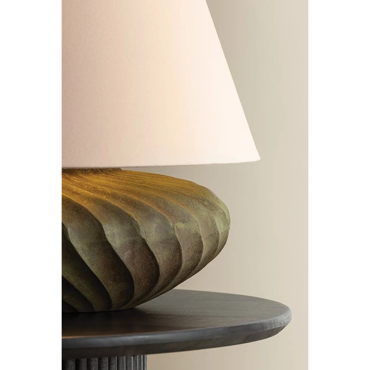 The Arlin family of table lamps pairs sculptural form with rich texture. Patterned metal bases feature a swirling motif that wraps each vessel shape, offered in two silhouettes: a fuller, more rounded form in Black Patina and a taller, generous form in Bronze Patina. Amethyst Home provides interior design, new home construction design consulting, vintage area rugs, and lighting in the Miami metro area.